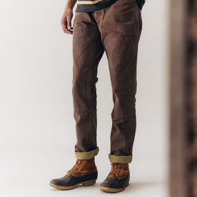 fit model posing in The Chore Pant in Aged Penny Chipped Canvas, Bottoms by Taylor Stitch