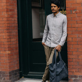 fit model leaning against the wall wearing The Jack in Blue Sky Slub Cotton Linen, Wovens by Taylor Stitch