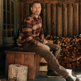 fit model sitting wearing The Ledge Shirt in Chestnut Plaid, Wovens by Taylor Stitch