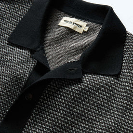 material shot of the collar on The Nichols Polo in Black Birdseye Merino, Knits by Taylor Stitch