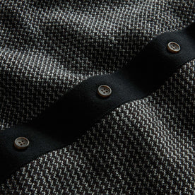 material shot of the buttons on The Nichols Polo in Black Birdseye Merino, Knits by Taylor Stitch