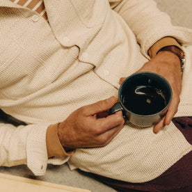 fit model drinking coffee wearing The Utility Shirt in Natural Sashiko, Wovens by Taylor Stitch