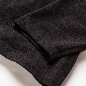 material shot of the sleeves on The Merino Henley in Heather Black, Knits by Taylor Stitch