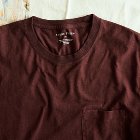 stylized shot of the neck opening on The Cotton Hemp Long Sleeve Tee in Burgundy, Knits by Taylor Stitch