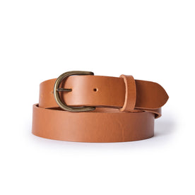 editorial image of The Foundation Belt in Whiskey rolled up, Accessories by Taylor Stitch