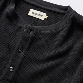 material shot of the neck opening and front placket on The Organic Cotton Waffle Henley in Coal, Knits by Taylor Stitch