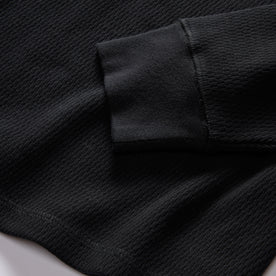 material shot of the rubbed cuff on The Organic Cotton Waffle Henley in Coal, Knits by Taylor Stitch