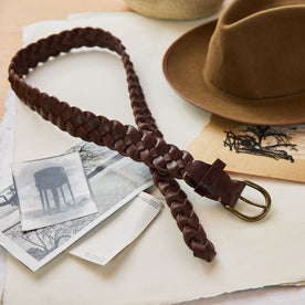 editorial image of The Braided Belt in Dark Brown laid out on paper, Accessories by Taylor Stitch