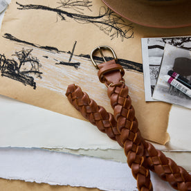 editorial image of The Braided Belt in Whiskey on a drawing, Accessories by Taylor Stitch