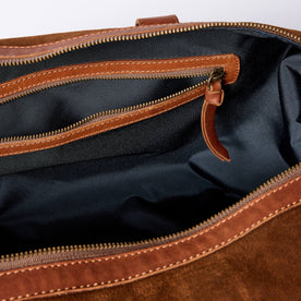 material shot of the zipper pocket on The Weekender Duffle in Chocolate Roughout, Accessories by Taylor Stitch