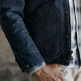 fit model showing the side pockets on The Workhorse Jacket in Navy Chipped Canvas, Outerwear by Taylor Stitch