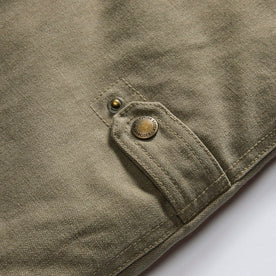 material shot of the side snaps on The Workhorse Vest in Stone Boss Duck, Outerwear by Taylor Stitch