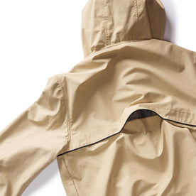 material shot of the back flap on The Chapman Anorak in Light Khaki, Outerwear by Taylor Stitch