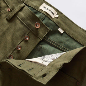 material shot of the button fly on The Democratic Jean in Olive Nihon Menpu Selvage, Bottoms by Taylor Stitch