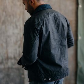 fit model showing off the back of The Long Haul Jacket in Coal Waxed Canvas, Outerwear by Taylor Stitch