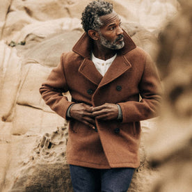 fit model buttoning The Mariner Coat in Tarnished Copper Wool, Outerwear by Taylor Stitch