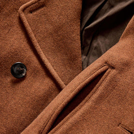 material shot of the horn buttons and pockets on The Mariner Coat in Tarnished Copper Wool, Outerwear by Taylor Stitch