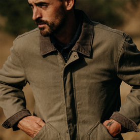 fit model with his hands in the pockets of The Workhorse Jacket in Stone Boss Duck, Outerwear by Taylor Stitch