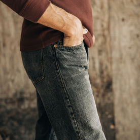 fit model standing in The Democratic Jean in Black 1-Year Wash Selvage Denim, Bottoms by Taylor Stitch