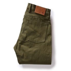 folded flatlay of the back of The Slim Jean in Olive Nihon Menpu Selvage, Bottoms by Taylor Stitch