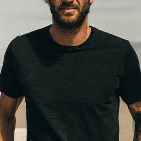 fit model showing off The Merino Tee in Heather Black, Knits by Taylor Stitch