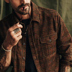 fit model showing the front of The Saddler Shirt in Dark Roast Plaid Cord, Wovens by Taylor Stitch