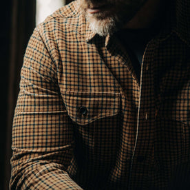 fit model showing the front flap pockets on The Saddler Shirt in Teak Plaid Cord, Wovens by Taylor Stitch