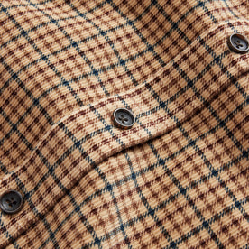 material shot of the buttons on The Saddler Shirt in Teak Plaid Cord, Wovens by Taylor Stitch