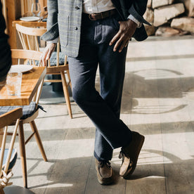 fit model crossing his legs in The Camp Pant in Navy Nep Wool, Bottoms by Taylor Stitch