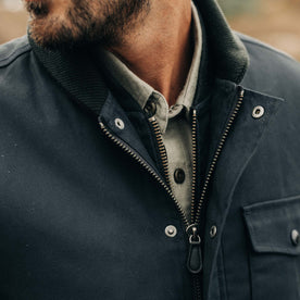 fit model showing the YKK zipper and leather pull tab on The Deck Jacket in Dark Navy Dry Wax, Outerwear by Taylor Stitch