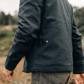 fit model showing the waist-level snap tab on The Deck Jacket in Dark Navy Dry Wax, Outerwear by Taylor Stitch