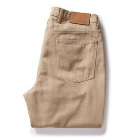 flatlay of The Democratic All Day Pant in Light Khaki Broken Twill, folded from back, Bottoms by Taylor Stitch