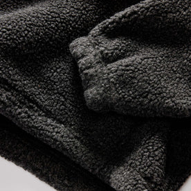 material shot of the sleeve on The Nomad Pullover in Charcoal Heather Sherpa, Knits by Taylor Stitch