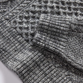 material shot of the ribbed cuff on The Orr Sweater in Marled Coal Merino, Knits by Taylor Stitch