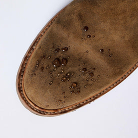 material shot of The Ranch Boot in Golden Brown Waxed Suede with water droplets on the suede, Footwear by Taylor Stitch