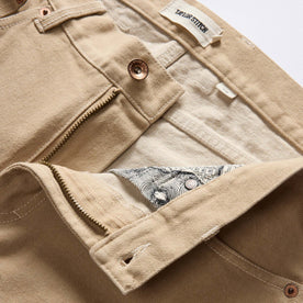 material shot of the zipper fly on The Slim All Day Pant in Light Khaki Broken Twill, Bottoms by Taylor Stitch