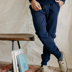 fit model crossing his legs in The Sunset Pant in Indigo Terry, Bottoms by Taylor Stitch