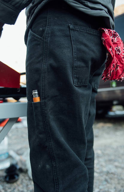 Close up on The Chore Pant pockets, holding tools.