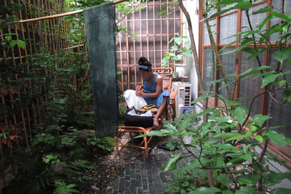 Teresa in the process of dyeing in her workspace