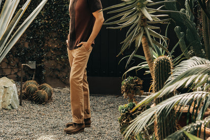 On the left, model leaning against the wall in The Ojai Jacket in Suede, and on the right, close up of model wearing The Ojai Jacket in Suede with a sweater