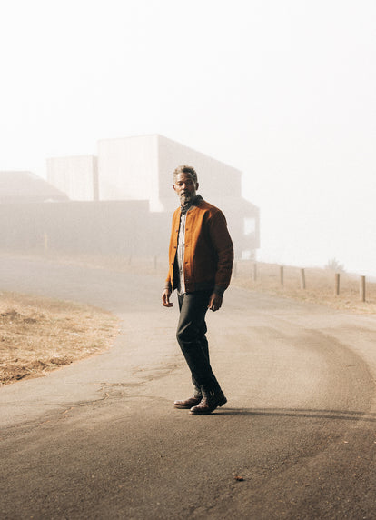 Model walking in front of Sea Ranch in The Bomber Jacket in Moleskin and The Jack in Smoke Oxford