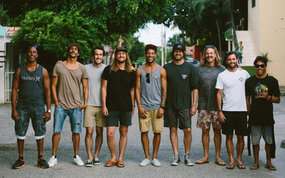 Our squad, casually posing in a formal line-up, out on a street.