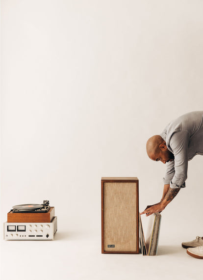 Model rifling through vinyl records