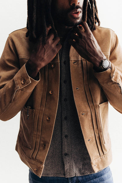 Model adjusting the collar on The Ryder Jacket