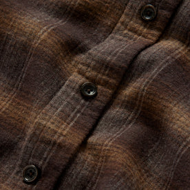 Material shot of the buttons on The Yosemite Shirt in Timber Shadow Plaid, Wovens by Taylor Stitch