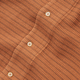 material shot of the buttons on The Short Sleeve Hawthorne in Rust Pickstitch Waffle, Wovens by Taylor Stitch