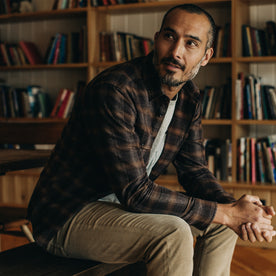 Fit model sitting in The Yosemite Shirt in Timber Shadow Plaid, Wovens by Taylor Stitch