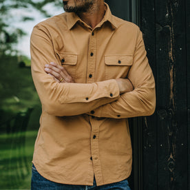 fit model with his arms crossed wearing The Yosemite Shirt in Tan, Wovens by Taylor Stitch