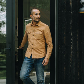 fit model walking in The Yosemite Shirt in Tan, Wovens by Taylor Stitch