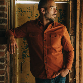 Fit model posing in The Yosemite Shirt in Copper, Wovens by Taylor Stitch